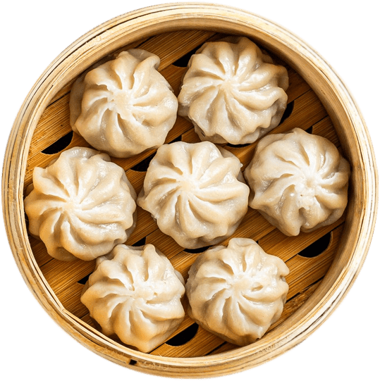 Steamed dumplings in a bamboo steamer